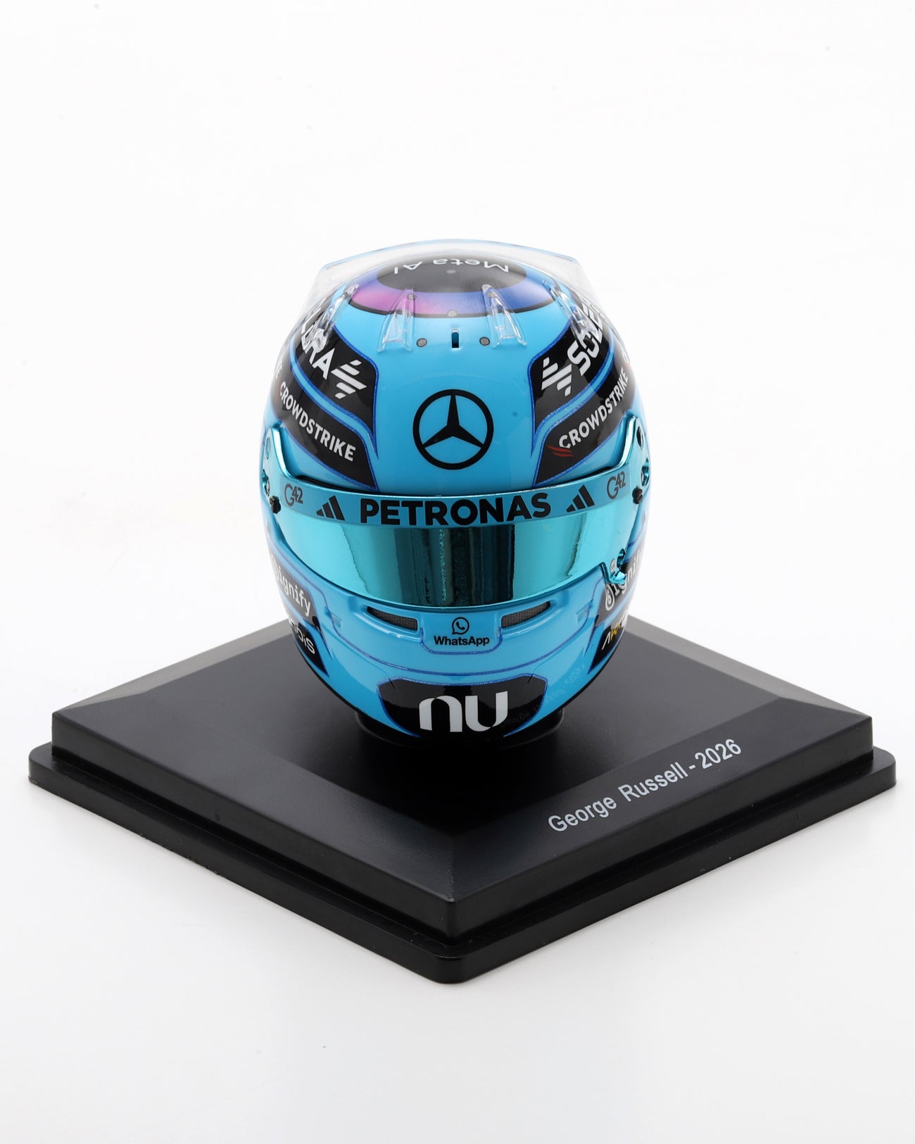 Blue 1:5 scale George Russell 2026 replica helmet with Mercedes branding and tinted visor on a black stand.