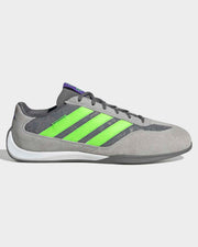 Gray adidas Feroza Lux motorsport shoes featuring vibrant lime green stripes and premium leather overlays.
